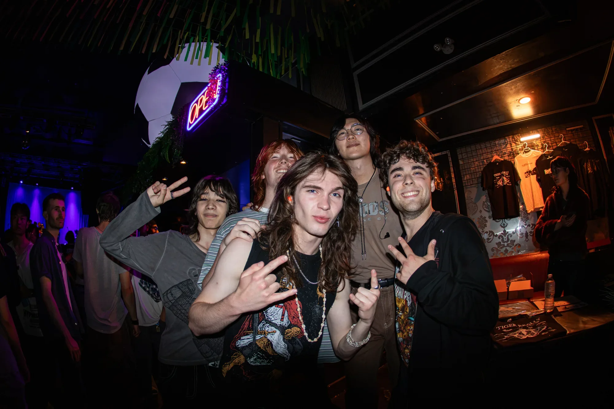 A group of fans posing with tiger really's frontman