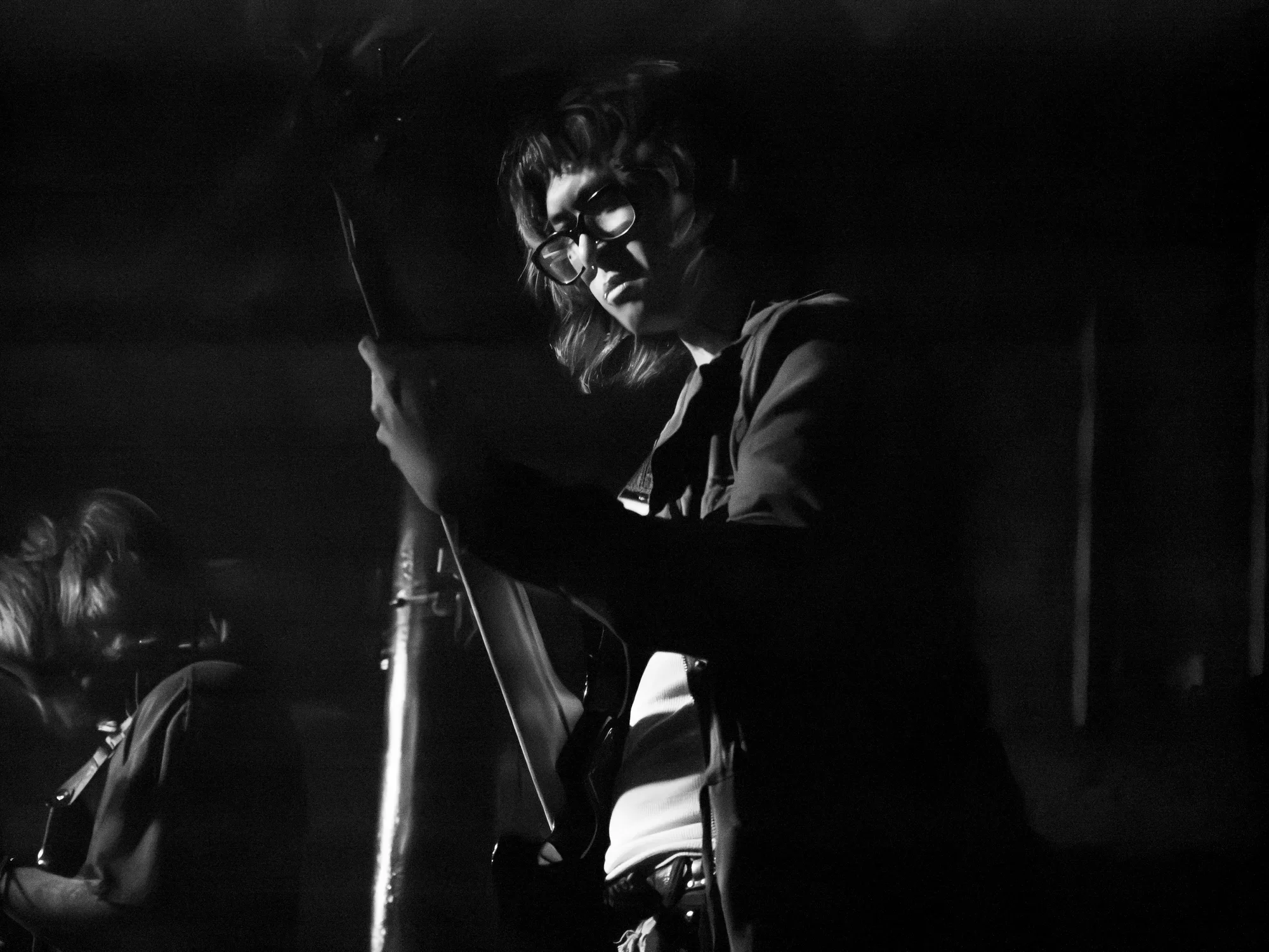 Moon Bruises performing at The Roxy Cabaret, photographed in black and white.