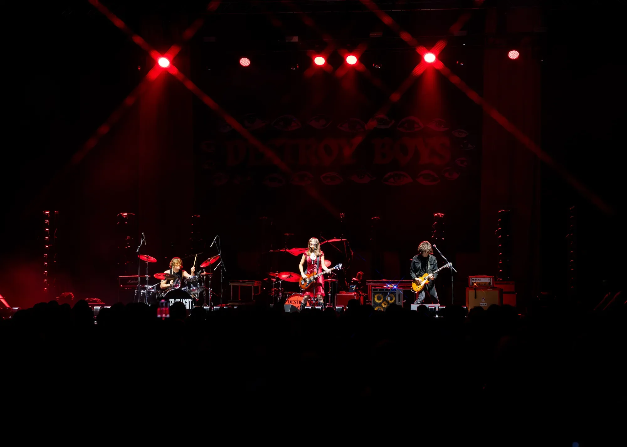 Speed of Light bathed in red backlight during their opening set at PNE Forum