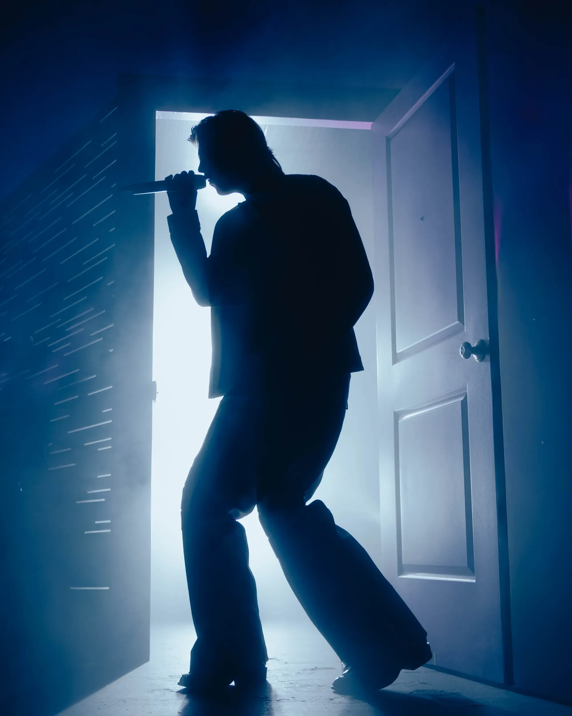 Ruel's silhouette emerging through stage smoke at Vogue Theatre